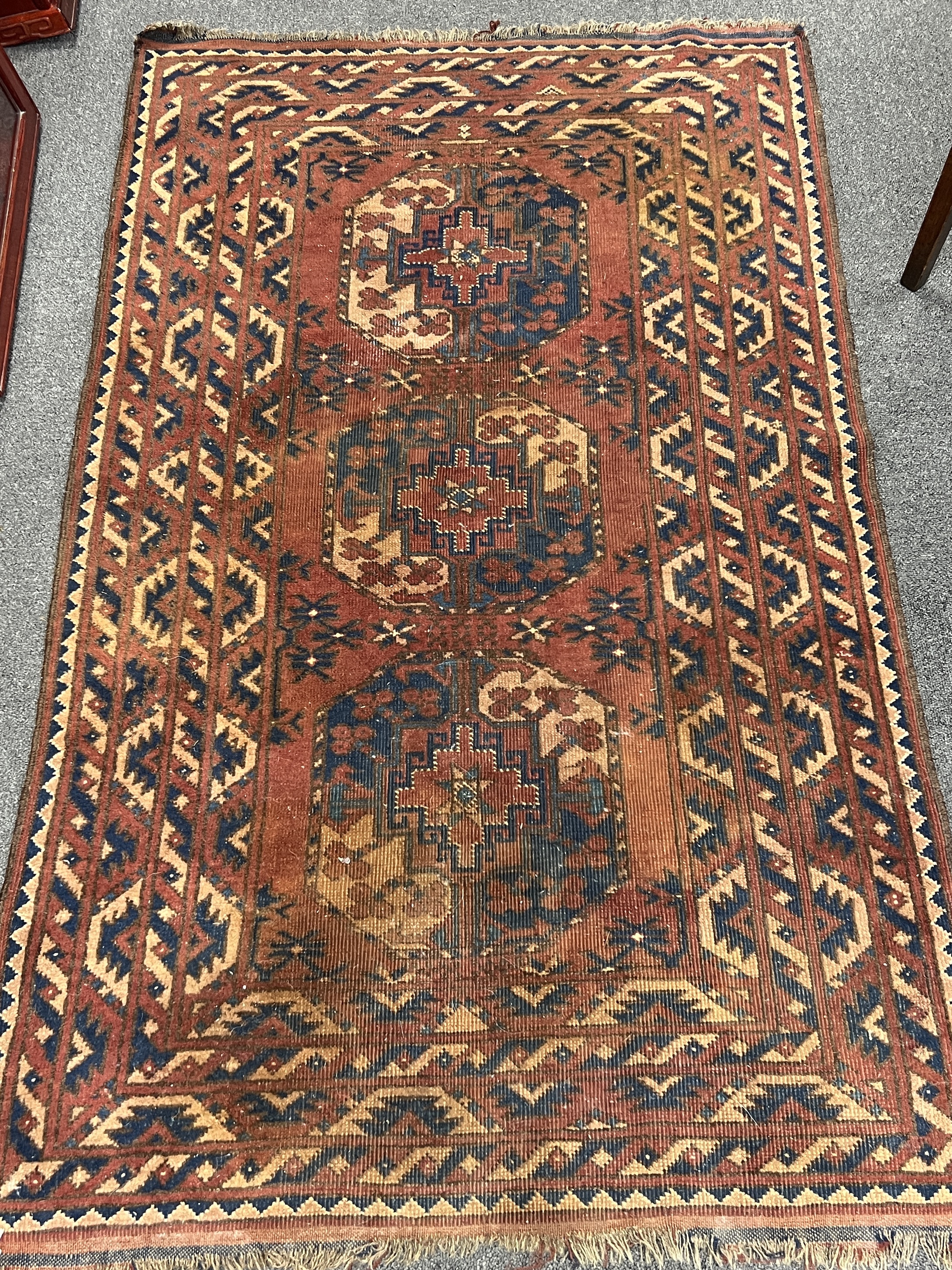 A Tekke red ground rug, 150 x 90cm